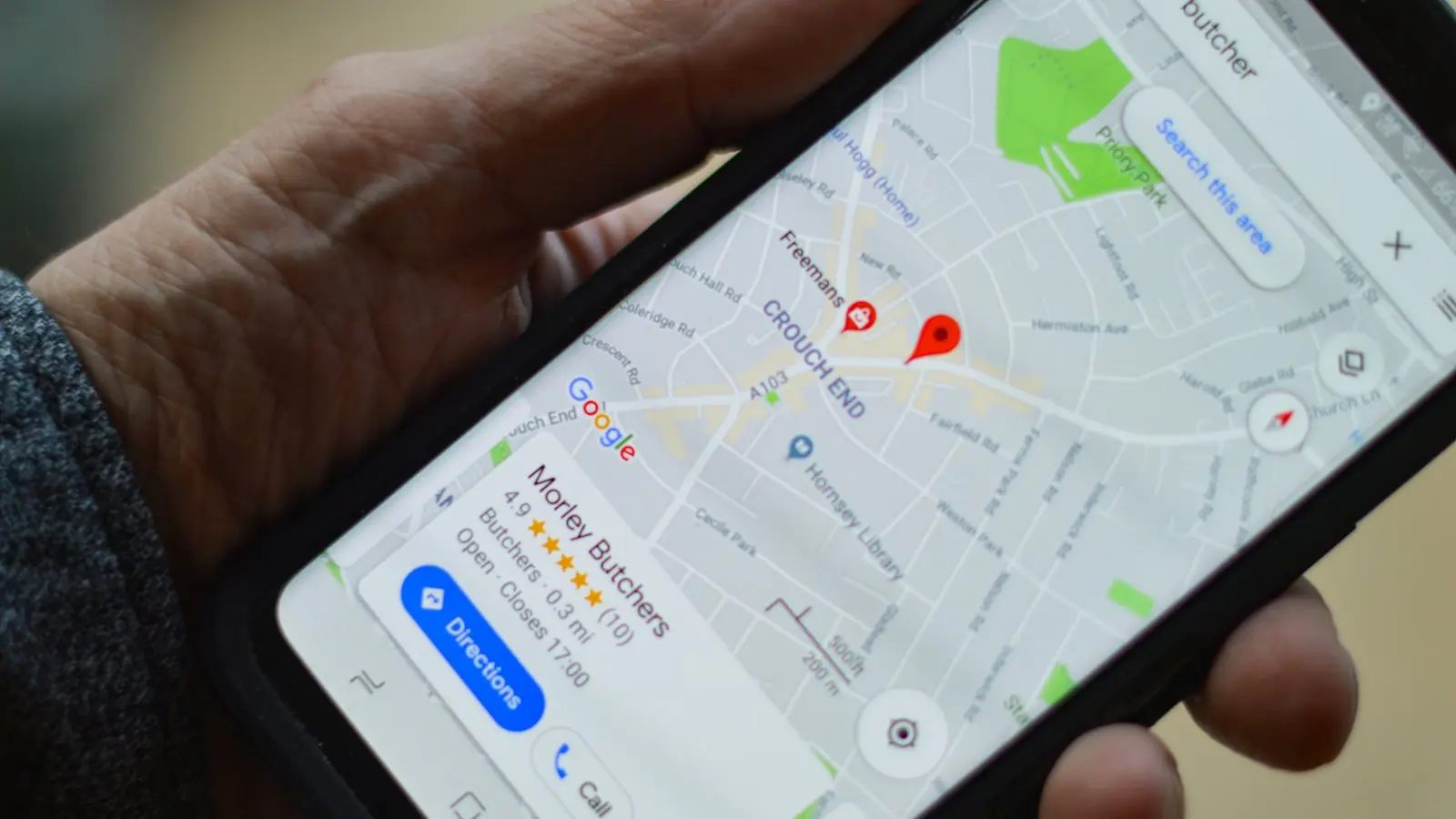 Phone showing Google Maps with a business listing